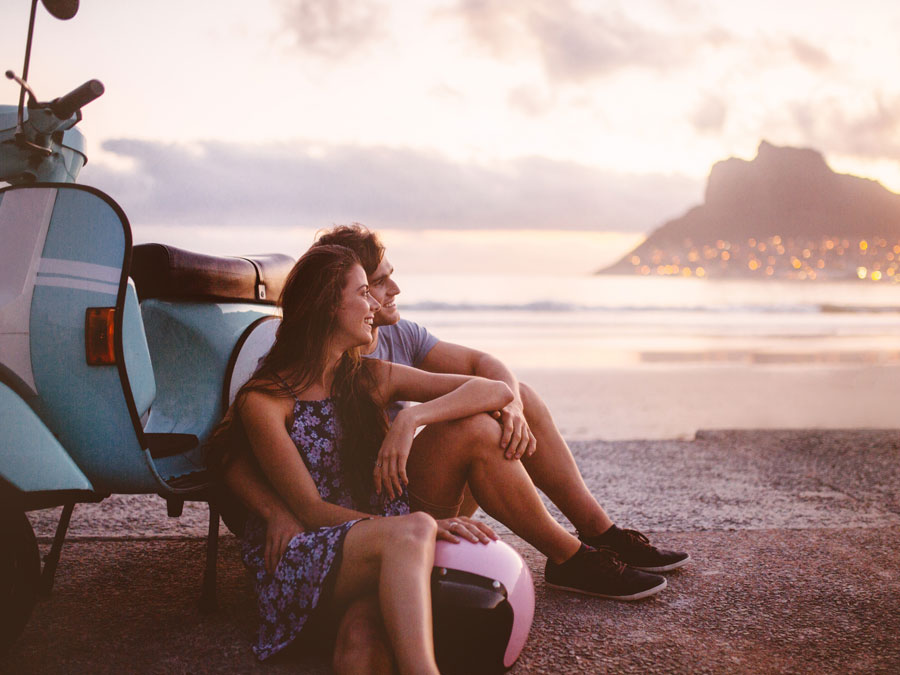 couple travelling taking a break on the beach