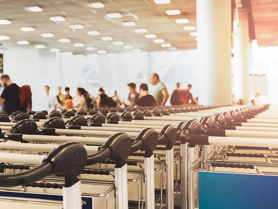 A line of trolleys in the airport