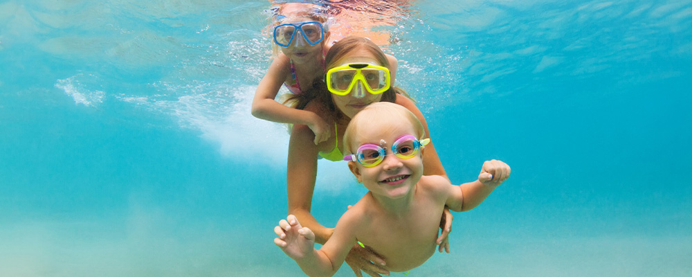 Family under water with snorkels on