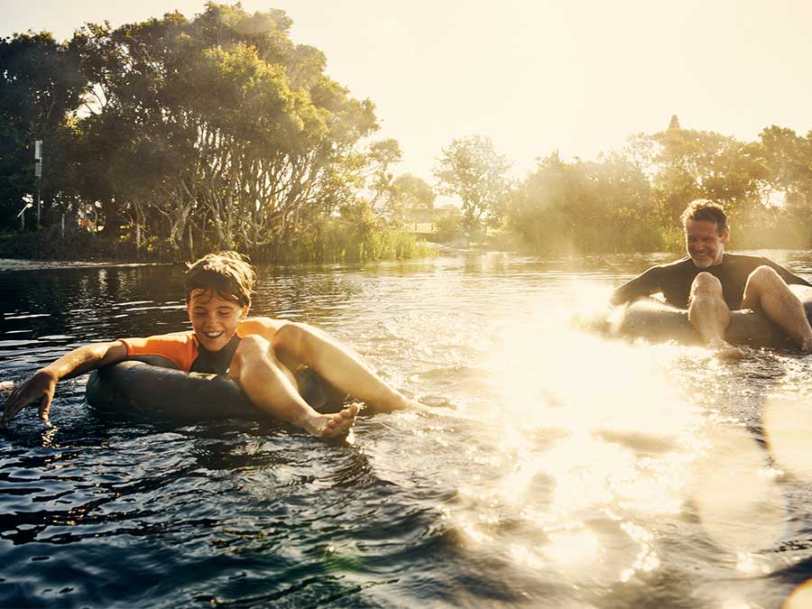 Father and son in a lake on holiday