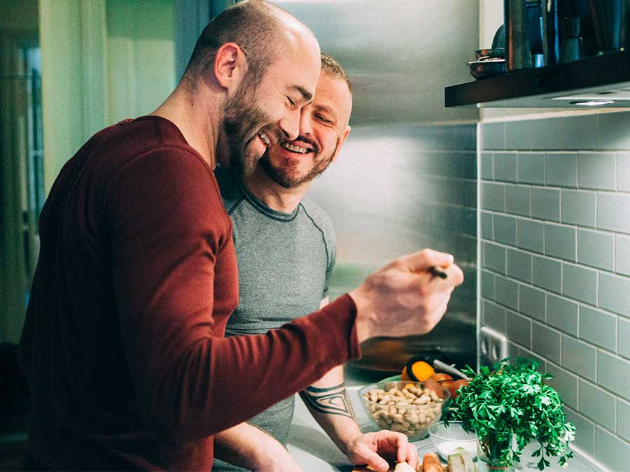 Guys using their accommodation's kitchen