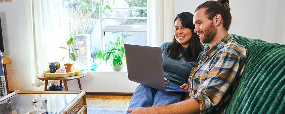 Couple looking at laptop