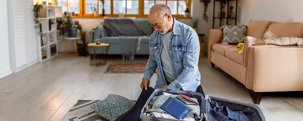 Man packing his suitcase