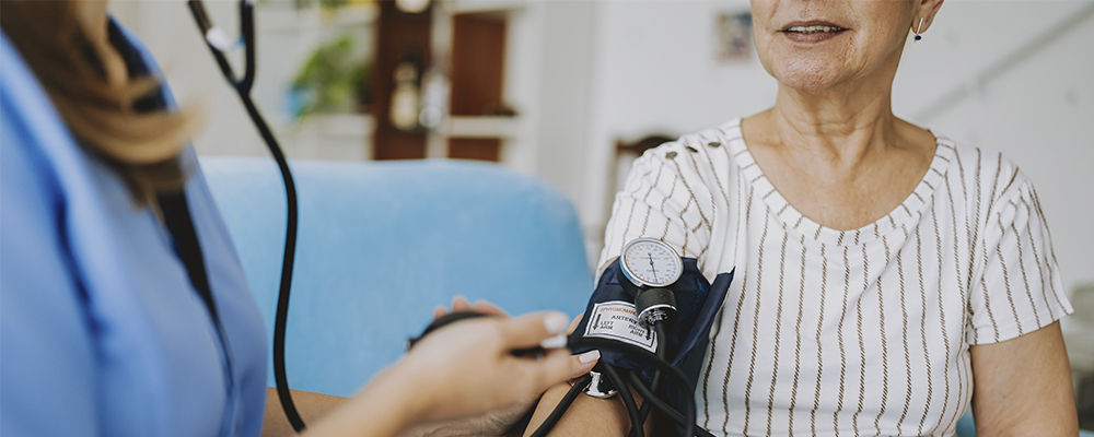 Woman getting her blood pressure taken